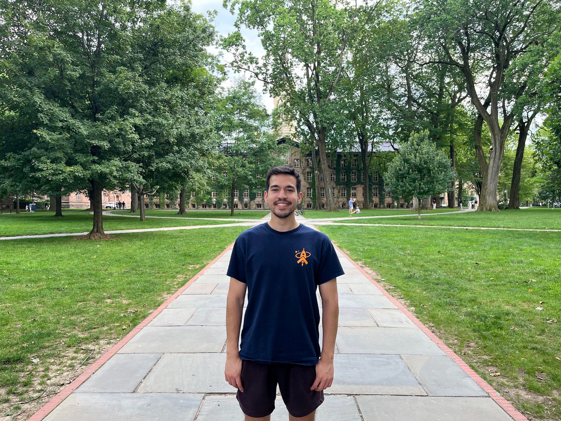 Sina standing on a walkway on Princeton University's campus.