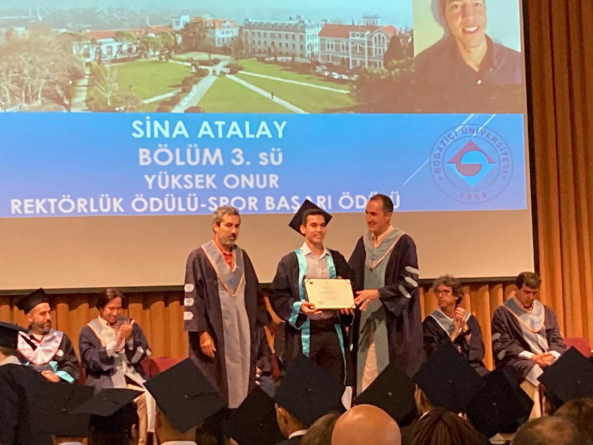 Sina receiving the Rector's Award and Sports Achievement Award at his 2023 Boğaziçi University graduation.